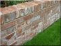 Brick wall made of broken bricks