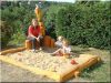 Acacia logs in sandpit