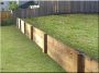 Plank retaining wall